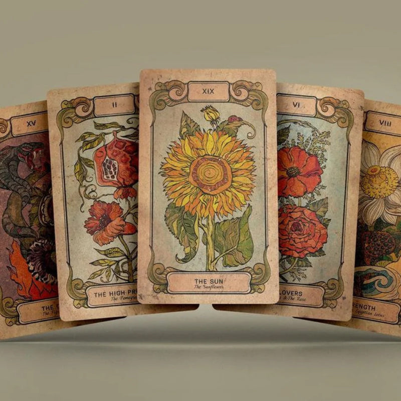Five cards from the Botanica Oculta Tarot Deck laid out
