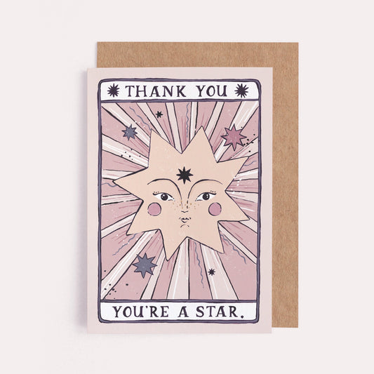 A greeting card designed like a tarot card that says "Thank You, You're a Star" with a smiling star illustration