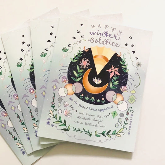 "Happy Winter Solstice" holiday cards depicting the moon and flowers