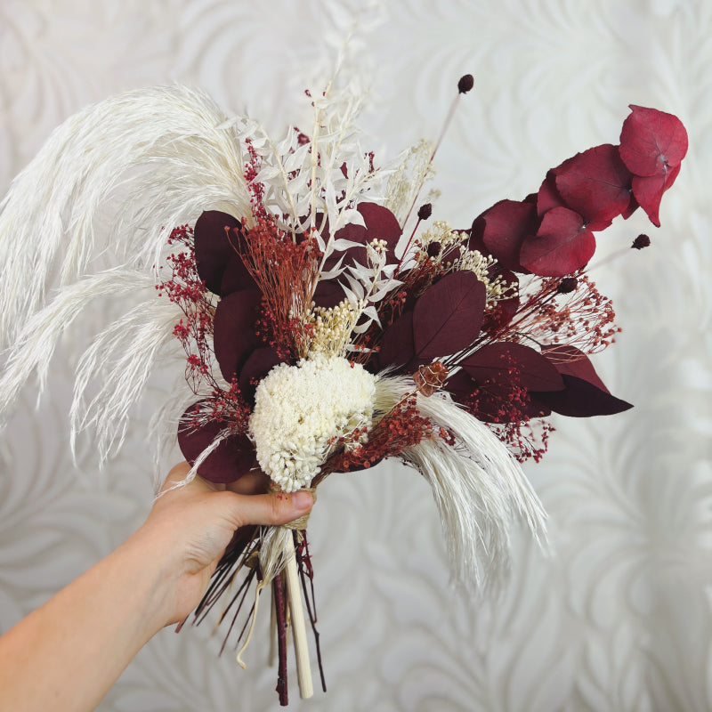 Dark red and white dried flower bouquet