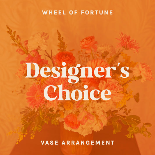 Text on orange background reads "Wheel of Fortune - Designer's Choice Vase Arrangement."