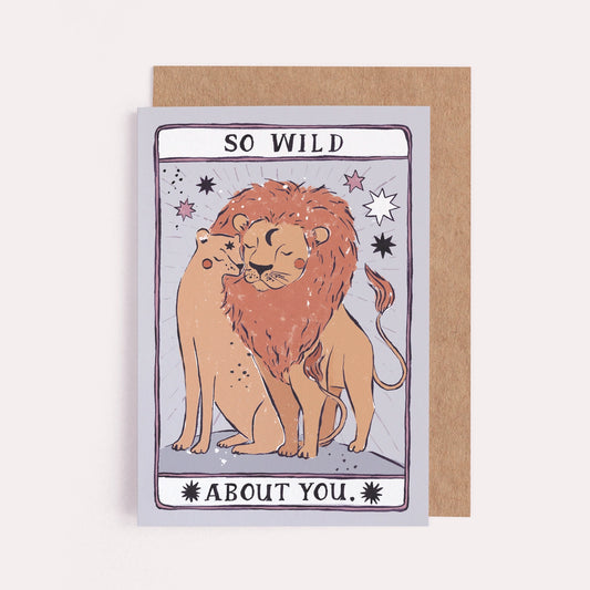 A greeting card with an illustration of two lions cuddling that reads "So wild about you"