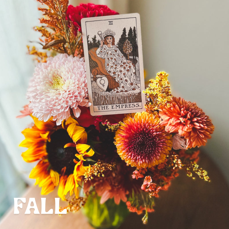 Seasonal fall vase arrangement with The Empress tarot card sitting on top