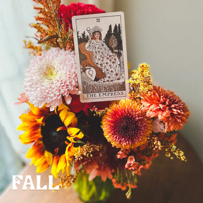 Seasonal fall vase arrangement with The Empress tarot card sitting on top