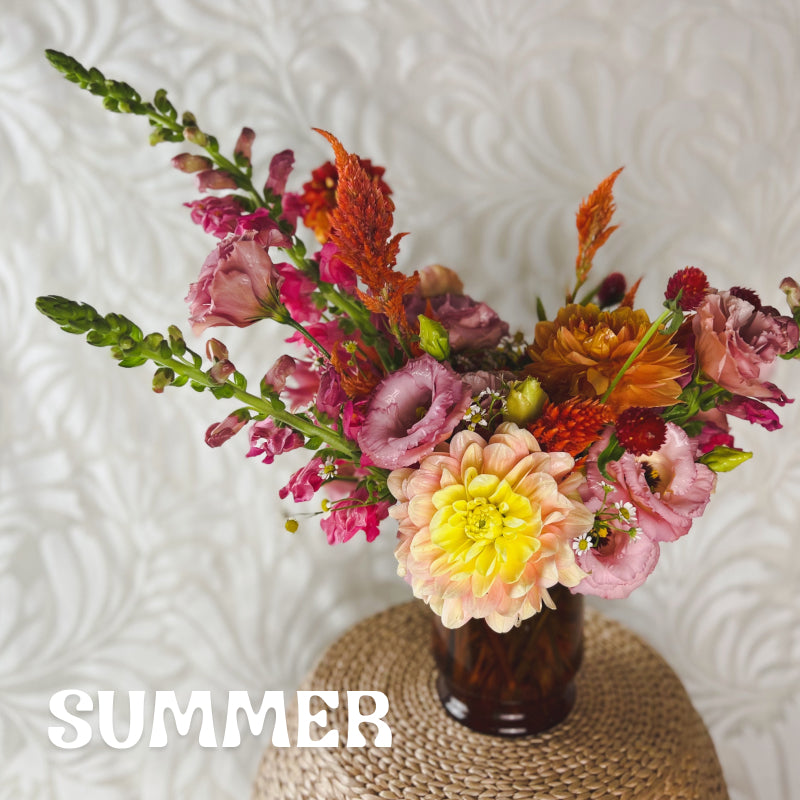 Standard size seasonal summer vase arrangement with a warm and fun color palette