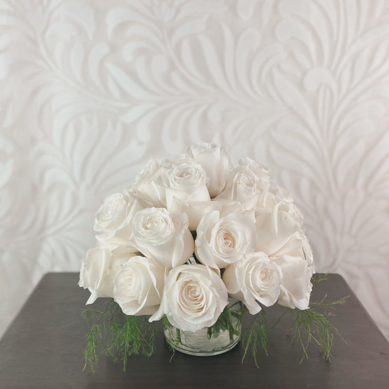 A domed arrangement of white roses