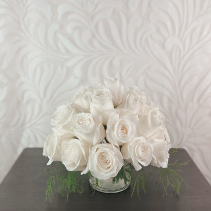 A domed arrangement of white roses