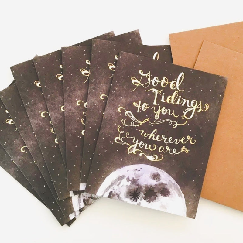 Magical Holiday cards with a picture of the moon in space that say "Good Tidings to You Wherever You Are"