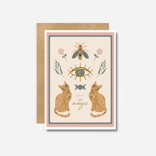 Greeting card with illustrations of cats, eye, bee, and flowers that says "you are magic"
